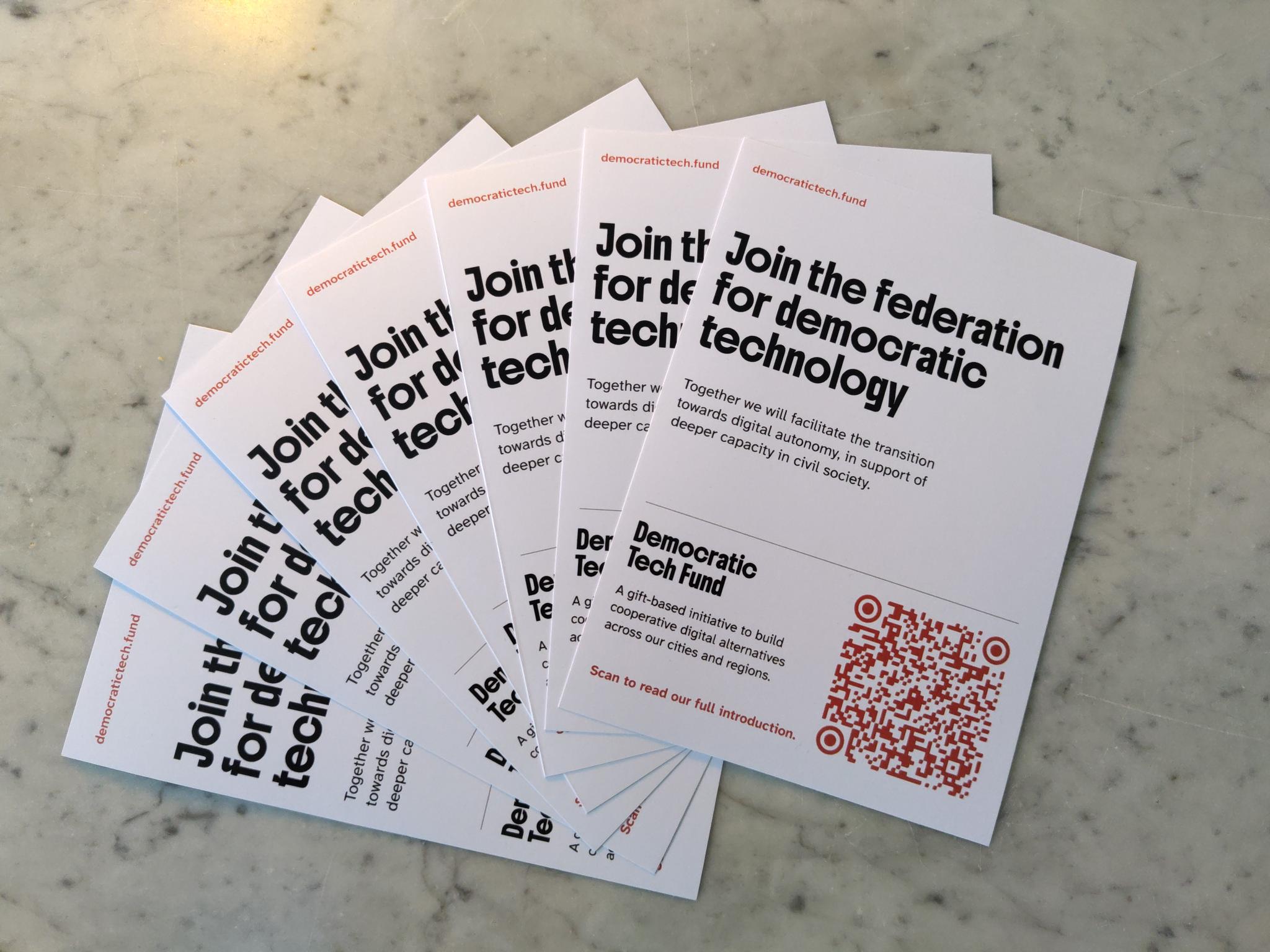photo of a set of flyers of the Democratic Tech Fund with a QR code